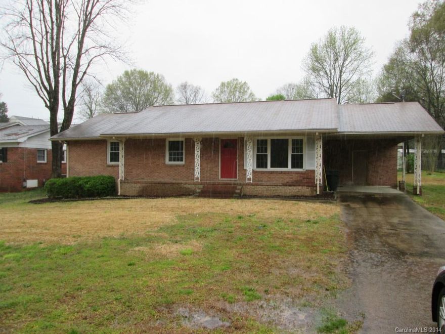 Brick Ranch with carport. Fresh paint, new carpet and vinyl. HVAC thought to be newer. Building behind house worth $10,000+.  Older home sold as is as it was the sellers parents.