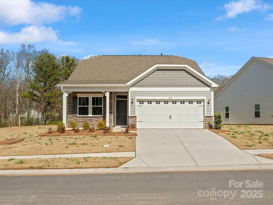 Welcome to your dream home in the heart of Wingate! This stunning 3 bed, 2 bath ranch provides over 1,600 square feet, perfect for relaxation and entertainment. The open floor plan features a beautiful kitchen with quartz countertops, seamlessly flowing into the dining and living area. Natural lighting enhances the open living concept, offering scenic views of your private backyard. Enjoy the luxurious primary suite with a spa-like en-suite bathroom, including a walk-in shower, quartz countertops, and a spacious walk-in closet. Step outside to your beautifully landscaped backyard, which features a patio—perfect for outdoor dining, morning coffee, or evening gatherings. Located just minutes from Wingate University, parks, shopping, and dining, this home offers the ideal blend of comfort and convenience. Don’t miss out on this exceptional opportunity—schedule a showing today and make this exquisite property your new home!