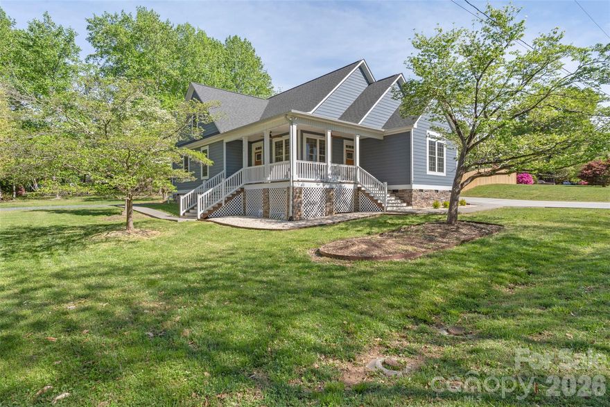 This 5-bedroom, 4-bathroom home offers 2,949 square feet of heated living space on a 0.41-acre corner lot in Locust, NC. No HOA and no restrictions. The open floor plan features a kitchen with quartz countertops, a large island, stainless steel appliances, and a walk-in pantry. The main-level primary suite includes high ceilings, an ensuite bath, and a walk-in closet. Two additional bedrooms on the main level share a full updated bathroom. Upstairs, a second primary suite offers a full bath, walk-in closet, and a flexible sitting area suitable for use as a bonus room or additional living space. A detached second living quarters is connected to the property and includes a separate bedroom, full bathroom, living room, and kitchenette — suitable for guests, extended family, or as additional living space. Buyer to verify permitted uses with Stanly County. The backyard is fully fenced and includes an in-ground saltwater pool, a gazebo, and a fire pit area. The driveway is oversized with dedicated RV parking on the side of the property. Located minutes from shopping and dining in Locust and approximately 12 miles from I-485.