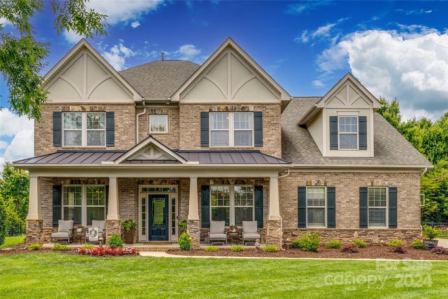 So much to love about this recently updated home offering privacy, serene views & ideally situated only 7 minutes from the bustle & vibrance of Ballantyne & 7 short minutes from the heart of charming downtown Fort Mill. Upon entering you'll be wowed by the gorgeous updates in the gourmet kitchen, bathrooms & throughout. The bright open floorplan, coffered ceiling, built-ins & stunning stone fireplace along with the large kitchen island, sitting nook & counterspace galore offer a spacious & inviting entertaining area. Upstairs boasts a relaxing primary suite w/ sitting area, large walk-in closet & ensuite bathroom; don't miss the huge bonus room with dual access through the back stairs making a fun hang-out perfect for game room, home theater or additional living space. But that's not all, the backyard oasis awaits where evenings can be enjoyed with a glass of wine & a good book or put the outdoor kitchen & firepit to use while entertaining friends & family and making lifelong memories.