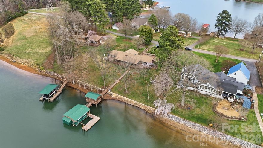In the market for amazing waterfront lot on LKN? Properties like this are increasingly rare - Sunset views from dock, potential sunrise views in front, level land, deep water, permitted dock with extra slip. . . This ~0.75-acre homesite offers an ideal canvas for a custom lakefront residence. An adjoining ~0.76-acre parcel is also available with full facilities for expanded waterfront acreage or additional VRBO income (see 232 Apache Rd). Fantastic opportunity for investor/builder or private owner to build their private retreat!

Set within a quiet, protected cove, the property offers both privacy and ease. A beautiful stone seawall enhances shoreline integrity and visual appeal. The expansive covered dock includes generous seating, a boat lift, and an additional slip. Designed for immediate enjoyment from day one.

Surrounded by established luxury homes, the setting supports lasting value and prestige. No HOA restrictions. Bring your preferred builder and design without limitation.

The existing ranch home with second living quarters conveys AS-IS. It offers immediate use or relaxed VRBO potential with cosmetic updates.

Just 40 minutes from Charlotte Douglas International Airport, this location offers seamless access by car or boat to refined dining, boutique shopping, and Lake Norman State Park’s outdoor recreation. 

Come experience the setting and imagine the lifestyle that awaits. . .