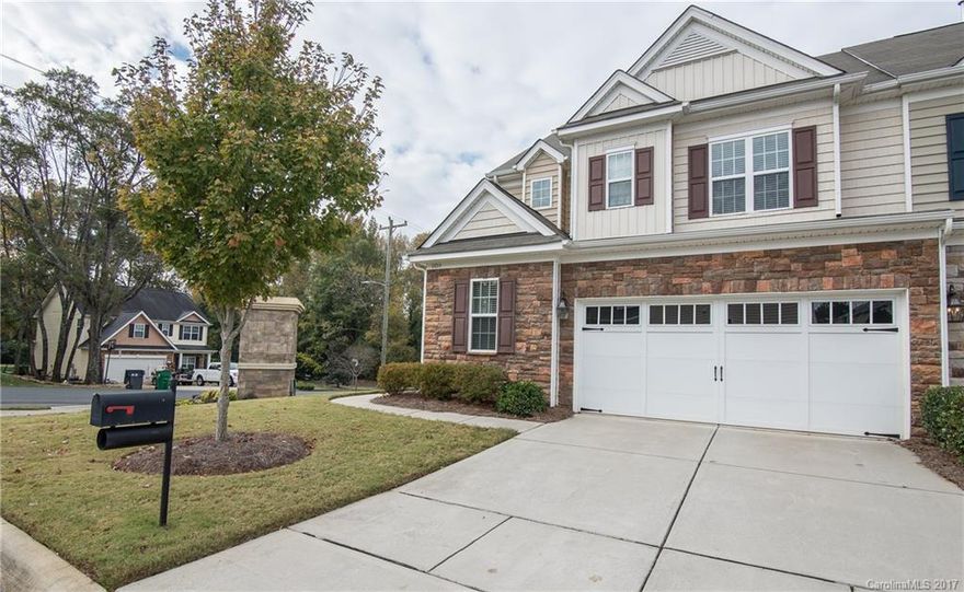 Gorgeous end unit with hardwoods on main! HUGE side yard and close to amenities! Granite counters, gas log fireplace, gas range, large master suite with trey ceiling, backyard patio and privacy fence from next door unit. We love this open floorplan! Close to shopping, dining,  and entertainment.