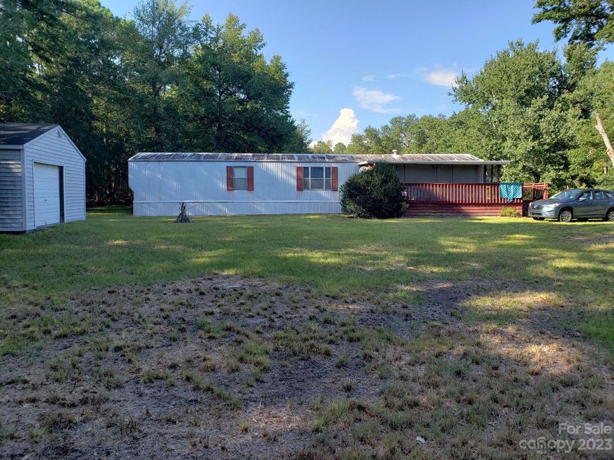 Quaint little mobile home positioned on two lots located in Coastal Retreat! Own your own little piece of paradise less than 4 miles from Holden Beach. This home has so much potential with 2 bedrooms and 2 full bathrooms, a large screened in porch for you to sit and enjoy your morning coffee, and a large shed for all your beach chairs, bikes, and coolers. Completely furnished and ready for you! Must see before its gone!