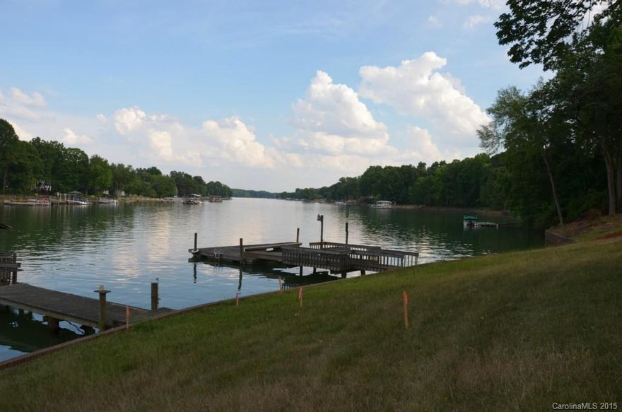 Amazing Waterfront opportunity! This lot is .75acres and features 132' of shoreline, beautiful mature hardwoods and a gentle walk to the water. A beautiful build site that has long rang water views, can support a 4 bdr room home and has room for a pool! Truly a must see and own. Tax value is of original parcel as well as legal description. Property has been surveyed and 4 bdr perk permit and Dock permit have been approved. 3.5 miles to ext35 &I77