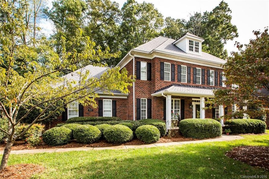 Gorgeous Full Brick Home Located on the Divide Golf Course! This lovely home has so many desirable features including a rocking chair front porch & dramatic entryway w/stunning Curved Staircase.  Lots of Hardwood Flooring. Kitchen w/Solid Surface Counters, Stainless Appliances including Jenn-Air Gas gas cooktop.  Butlers Pantry/Wet Bar w/Glass Cabinet & Office Niche. Family Room is Open to Kitchen & Breakfast.  Office on Main. Master Bedroom w/Sitting Room.  All Bedrooms Have Connecting Baths.