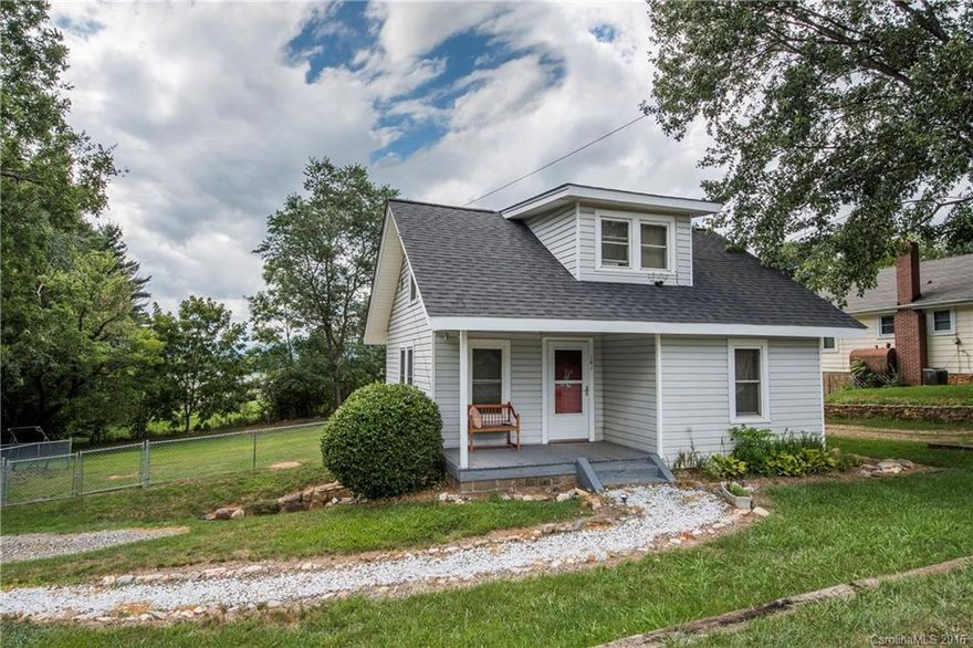 Charming older home with character. Conveniently located to Waynesville, Clyde, Canton, and I-40 with level and spacious fenced  back yard. Perfect starter home or rental opportunity. Covered front porch and wonderful back deck for entertaining. Newer roof and plenty of basement storage.
