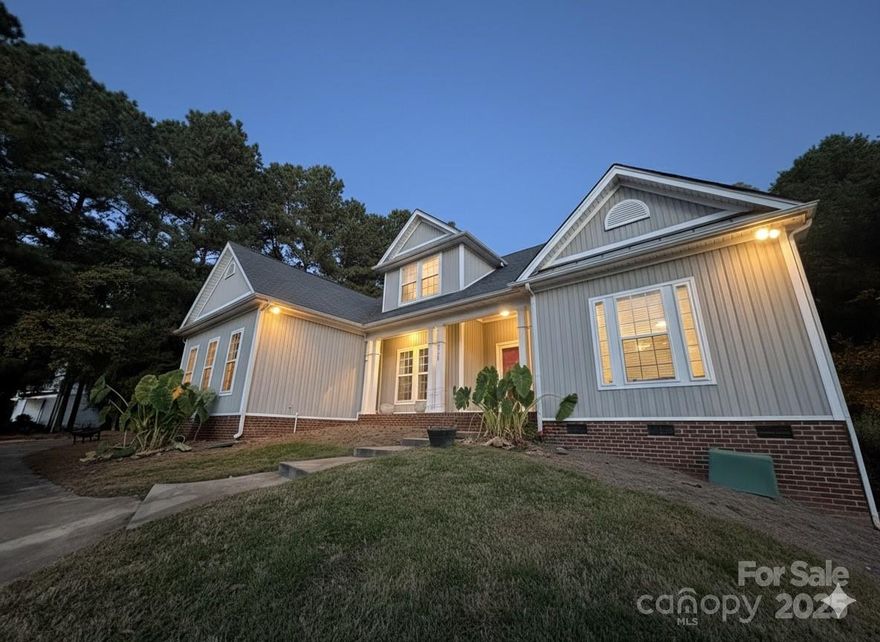 Tucked away near the heart of Mint Hill, this charming 5-bedroom, 2-bath home offers the perfect balance of space, comfort, and convenience. From the moment you arrive, the circle driveway sets the tone—welcoming you home with classic Southern charm and plenty of parking for family and guests.

Step inside, and you’ll immediately notice the sense of warmth and openness that flows throughout the main level. With four bedrooms conveniently located downstairs, there’s room for everyone to spread out while still keeping a connected feel. Each room offers its own character—ideal for family, guests, a home office, or even a playroom.

Upstairs, a spacious fifth bedroom provides a private retreat. Whether you envision it as a luxurious primary suite, a quiet guest hideaway, or a creative flex space, this upstairs oasis offers endless possibilities.

The heart of the home invites gatherings and everyday living. A comfortable living area, well-equipped kitchen, and dining space come together seamlessly perfect for weeknight dinners or weekend entertaining. Natural light filters through the windows, adding a cozy glow to every corner.

The heart of the home brings everyone together with a comfortable living area, a bright kitchen, and a welcoming dining space, ideal for everyday moments and special gatherings alike. Natural light fills each room, creating a warm and inviting atmosphere throughout.

Step outside to discover your personal outdoor oasis. A large back porch with low-maintenance composite decking extends your living space, offering the perfect spot for morning coffee, family cookouts, or peaceful evenings under the stars. Overlooking the fully fenced backyard, it’s an entertainer’s dream and a serene escape all in one.

Located just minutes from Mint Hill’s popular shops, dining, parks, and conveniences, this home delivers the best of both worlds, peaceful suburban living with quick access to everything you need. Enjoy quiet mornings, friendly neighbors, and the small-town charm Mint Hill is known for.

With its thoughtful layout, inviting outdoor spaces, and unbeatable location, this Mint Hill gem is more than just a house, it’s a place to call home. Come see where your next chapter begins.

Home is listed as 4 bedroom but there is a passion bonus room with closets currently used as a bedroom upstairs.
