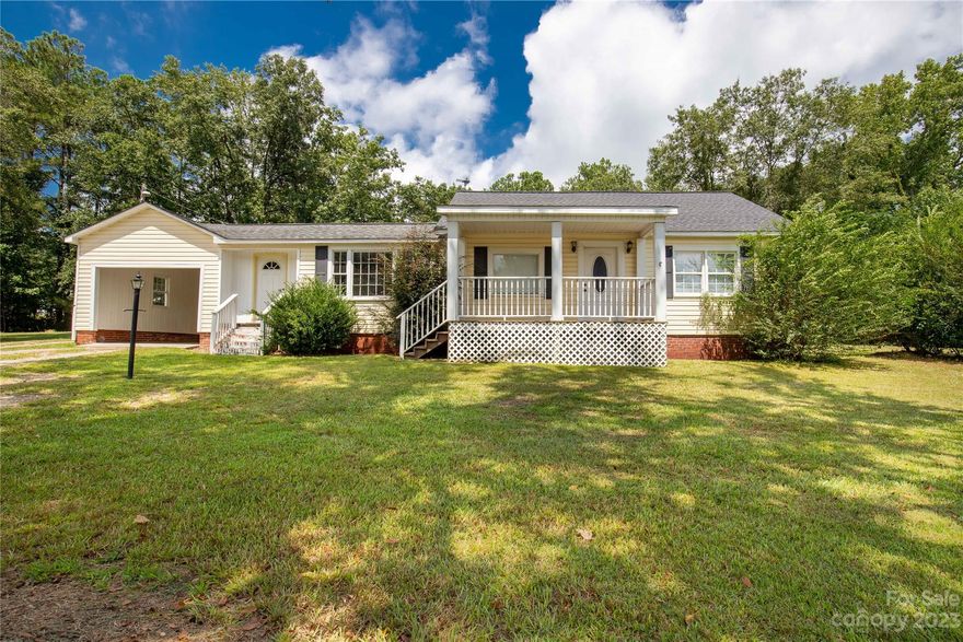 Charming home in rural setting close to the convenience of town. The home is is in move in condition and comes with appliances which includes a dishwasher! This home features a large yard that has a partially wooded lot. You can enjoy the view from the back deck. Roof, water heater, and HVAC are 3 years old. The carport and laundry room are nice features as well. Property being sold AS-IS, price is firm.