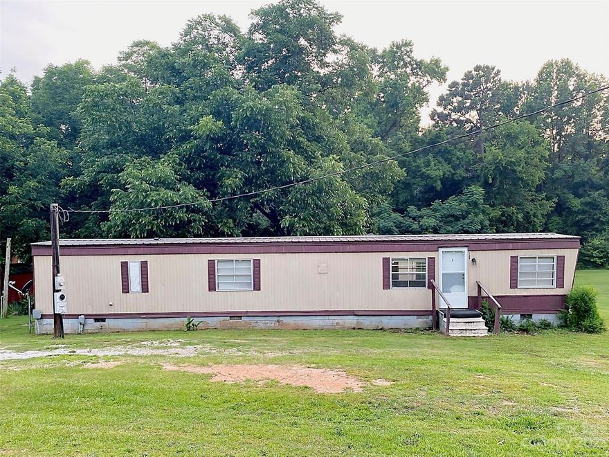 This property is being listed "AS IS."  CASH ONLY!
If you are looking for just the right investment property, this property is for you, or it would make the perfect property for a someone looking for a small starter home! It is located in the town of Jefferson, SC.  Heating and air were working, when the home was last rented.  The home could be rented out monthly for $500 or more. This home has had repairs and updated after it was purchased by the current owner.  The roof was replaced 4 yrs ago. The city passed an ordinance against mobile homes, so when this one is removed, future mobile homes will not be allowed, however, more repairs can be made to this one.  This lot could be used to build a new home, or purchased to continue as a rental for monthly income potential. This property is centrally located in town.  It is currently vacant.