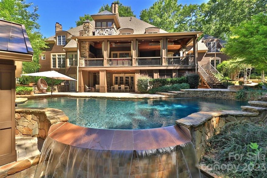 Resort living w/the convenience of the heart of Southpark. Enjoy serene privacy nestled on just over an acre. The outdoor living is all that's needed w/the incredible covered porch w/built-in kitchen, heaters, woodburning fireplace that overlooks your own oasis w/pool, spa, & pool house w/half bath. Plenty of yard for gardening & play. Gorgeous walnut double doors welcome you to the curved staircase, two sided stone fireplace & stunning library. This open floorplan is the epitome of wonderful gatherings & entertainment whether that be the main floor open to chef's kitchen w/keeping room & great room OR the fabulous basement w/full bar, media & rec room. Primary suite is indulgent w/sitting area, fireplace, spa inspired bath w/steam shower, dual water closets, expansive walk-in closet w/storage island & 2 add'l closets, & flex space for office or exercise. All secondary bedrms are ensuite incl one on main. Roof, Siding, 3 HVACS, 3 tankless H20 heaters, pool equipment have been replaced.