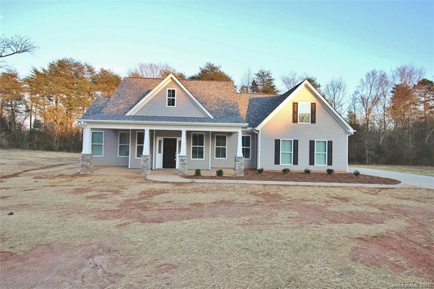 Custom Craftsman, beautifully upgraded & ready to move in!  Rocking chair front porch welcomes you as you enter through the front door. Hand scrapped engineered hdwds line the main living areas. Open floorplan. Kitchen boasts custom cabinetry w/ slow close feature, island & lots of granite counter tops to prepare culinary creations!  Master BR w/ master BA is a must see!  2 more BR’s and bath are located on main floor, bonus w/ 3rd bath is upstairs. 2 car oversized garage all located on 1 acre.