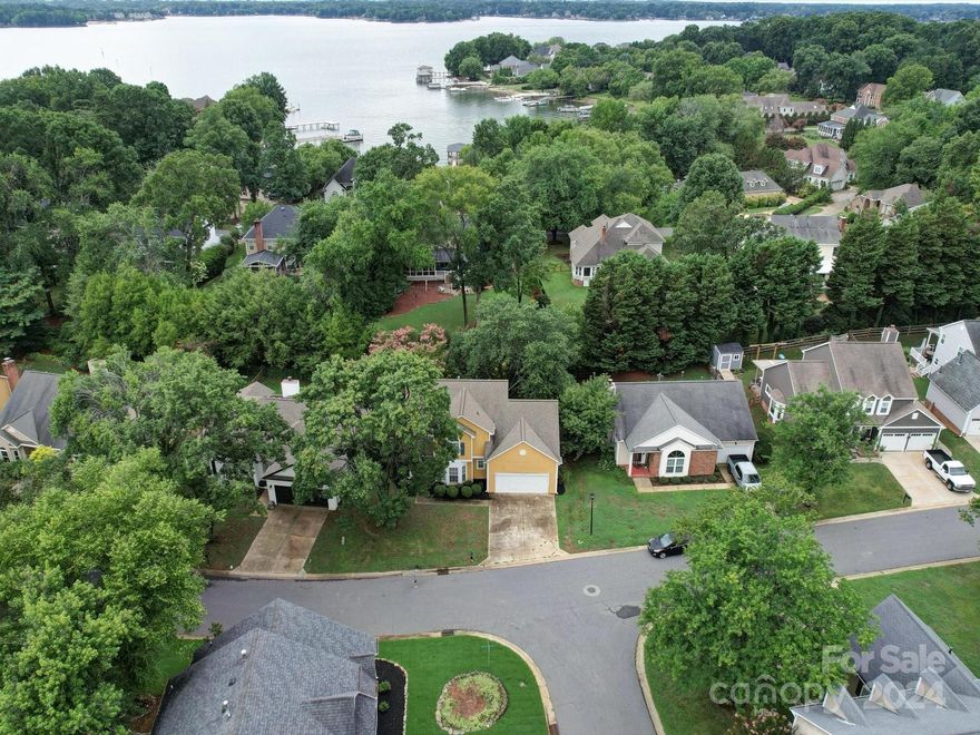 A deeded boat slip comes with this updated 4 bed, 2.5 bath home in the desirable Bridgeport waterfront community. This home is situated on the serene Langtree Peninsula just minutes off the highway with low Iredell taxes and easy commute to shops and restaurants. Enjoy your evenings on the lake year round with ease, courtesy of the deeded exterior deep water boat slip! It boasts an open floorplan with bright white kitchen, great room with fireplace and lots of natural light, 4 spacious bedrooms (one with walk in attic storage), gorgeous updated bathrooms, a private backyard with oversized deck for entertaining! Sellers have put a lot of updates and work into the home and it shows! The amenities of Bridgeport community include the community pool, playground, lighted tennis and pickle ball courts, boat storage area, boat launch and day dock, along with secure boat slip area.