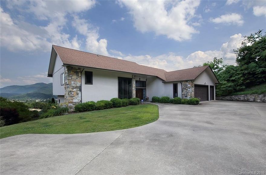 Views, views, views! This Laurel Ridge custom-built contemporary home showcases mountain & golf course views from nearly every room.  No steep roads; flat driveway & main level garage. Open, airy floor plan & multiple decks invite the outdoors inside. Large master suite w/private deck & views is entire upper level. Vaulted ceiling in great rm; two stone gas FPs; wet bar in large family rm for entertaining. Two laundries; one in garage & one on lower level.  All furnishings included!