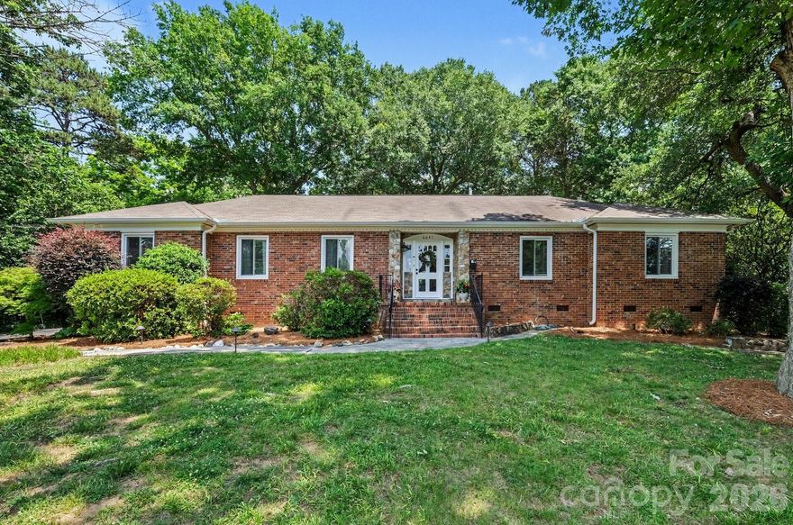 Welcome to highly sought-after Olde Providence, one of South Charlotte’s most established and desirable neighborhoods. Nestled on an almost one-acre private lot and surrounded by million-dollar-plus homes, this classic all-brick ranch offers timeless charm, incredible value, and room to make it your own.Step inside and immediately feel the character and warmth with a nostalgic sunken living room, step-up dining room, and an abundance of natural light throughout. The spacious kitchen opens seamlessly to the cozy den featuring a stunning stone fireplace — the perfect gathering space for everyday living and entertaining.The primary suite offers dual walk-in closets, an ensuite bath, and beautiful backyard views. Three additional bedrooms provide flexibility for guests, home office space, or future growth. You’ll also appreciate the exceptional storage throughout the home.Enjoy peaceful mornings on the back porch and relaxing evenings on the patio overlooking the private backyard retreat. Major updates already completed include HVAC (2026), interior & exterior paint (2026), electrical panel (2025), gutters (2022), and seller to replace roof prior to closing.Rare opportunity to own a lovingly maintained home in an unbeatable South Charlotte location close to shopping, dining, top-rated schools, and everything the area has to offer.