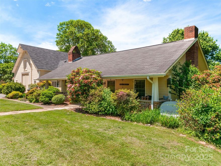 BACK ON THE MARKET! NO FAULT OF THE SELLERS!! This 1930-built, 2,294 sq ft home on over 3 acres captivates with its breathtaking long-range mountain views, a feature that defines its charm and sets it apart. Nestled in a serene landscape, the property blends historic character with modern updates, including a recent addition, a two-zone HVAC system, and an updated roof. The sprawling 3*-bedroom 2-bath layout boasts a huge primary suite with a Juliette deck, a great room with vaulted ceilings and exposed beams, and a formal living room with built-ins and a fireplace. A double car garage in the basement, a 600 sq ft workshop, and a private well enhance functionality, while the covered front porch and rear deck invite you to soak in the stunning vistas that make this home unforgettable