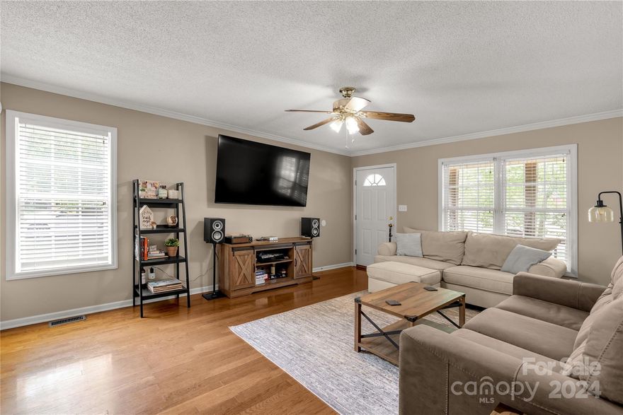 This 3 BR/2 BA home isn't just a house, it's a lifestyle! Imagine cozy movie nights or hosting fabulous parties! This home is situated on a .39 acre corner lot and is bathed in natural light! With the floor plan this home offers you can easily entertain guests or retreat easily for peace! This home is perfect for those seeking space to breathe, entertain, & create lasting memories. The living room features hardwood floors, the dining room offers picture frame accents, all bedrooms are a great size. Parking is a breeze with the attached carport and store your outside toys in the storage shed. Schedule your showing today & discover the hidden gem waiting to be your happy place!