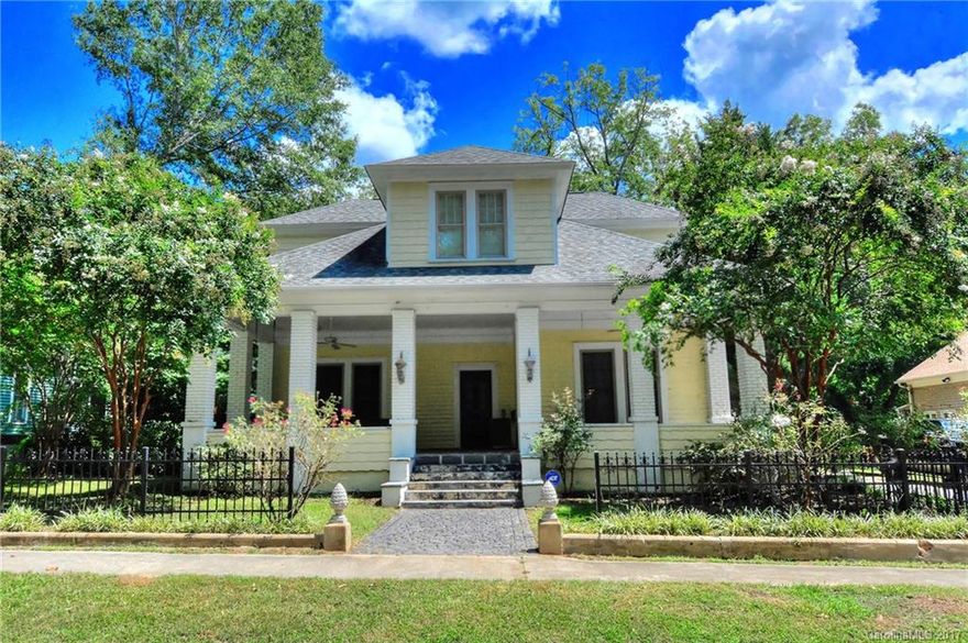 Stroll through the historic district of York "The Charleston of the Upstate" & you'll be drawn to this home's large front porch. The grand entry invites you to discover the beauty of this thoughtfully & lovingly restored home by Boccaccio. Complete reno w/original character. Kitchen boasts large island, granite, SS, FP & plenty of custom maple cabinets. Exquisite master suite w/oversized shower, whirlpool tub, walk-in closet & office. All new baths. Covered patio, 100 yr old gardners cottage.