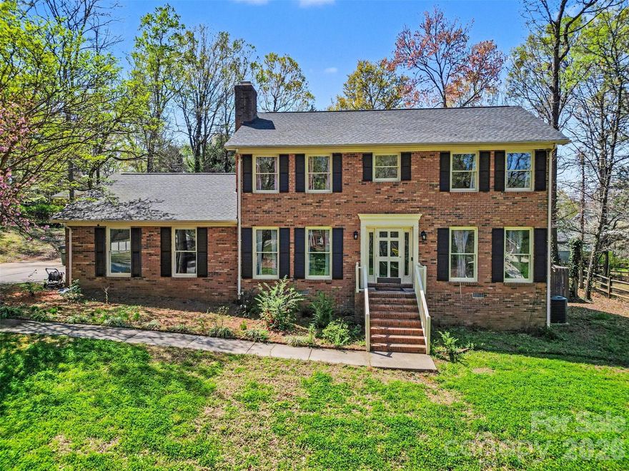 Tucked away on a private cul-de-sac lot just under an acre, this full brick home offers mature trees, exceptional curb appeal, and a true backyard retreat. Enjoy your own oasis with an in-ground pool, spacious deck, and plenty of room to entertain or unwind, with a pool liner replaced in 2022. Inside, the updated 2024 kitchen features Samsung Bespoke appliances, quartz countertops with a matching backsplash, a waterfall faucet sink, and ceramic tile flooring, while wood flooring flows throughout the main level. The inviting family room showcases a wood-burning fireplace with a marble surround, and both the primary and hall bathrooms have been beautifully renovated, including a primary suite with a Bluetooth speaker and night light system. Additional highlights include a side-entry 2-car garage with dual Tesla charging stations, roof and HVAC replaced between 2021–2022, and a Power Pet fully automatic pet door in the laundry area. Ideally located just minutes from Concord Mills, Afton Ridge, the airport, Cabarrus Country Club, and the NC Research Campus, this home offers privacy, upgrades, and convenience all in one!