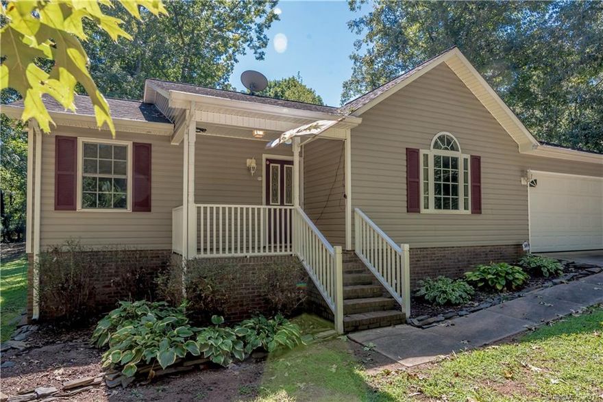 Well maintained three bed, two bath home on a quiet street near Moss Lake! Home features a covered front porch, stone fireplace, attached garage, and a back yard for entertaining! Seller has invested over $30,000 in stamped cement patio, large wooden deck that surrounds a hot tub and swimming pool. Deck leads to a finished building that has a bar within. Adjacent half acre lot also available by seller, who prefers sold together.