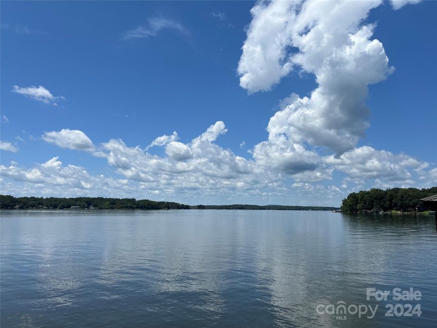 Unwind in Luxury: Your Lake Wylie Oasis Awaits!  Discover the epitome of lakeside living on this stunning lakefront lot in the exclusive gated community of Joslin Pointe. Immerse yourself in breathtaking main channel views of Lake Wylie from your future dream home.  Enjoy easy access to the water with gentle topography and a covered dock complete with a boat and jet ski lifts. Spend your days swimming, boating, or simply relaxing in the community pool and clubhouse. Experience the ultimate in comfort and convenience with this prime location, offering proximity to dining, shopping, and I-77.  Don't miss this rare chance to own a piece of paradise and the opportunity to build your forever home in this idyllic setting.