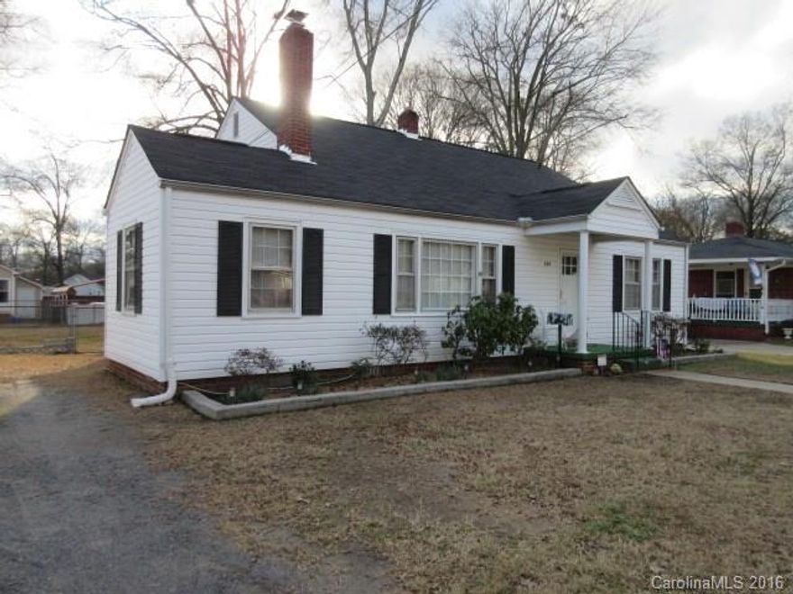 Fantastic opportunity for very well-maintained starter home. Large lot with fenced backyard, separate workshop with electricity, fresh interior paint, central heat/air, appliances to remain: refrigerator, washer, dryer, gas stove. Masonry fireplace and hardwoods throughout. Home features a large floored attic. Third room can be used as a bedroom. Side porch offers flexible space for office or storage. One year home warranty included.