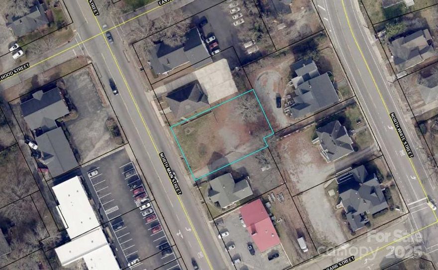 This cleared lot includes an existing driveway and is zoned commercial. It offers excellent potential, whether for new development or as an expanded parking area for the nearby office building at 302 N White Street (MLS #4242970), which is also available for sale by the same seller.