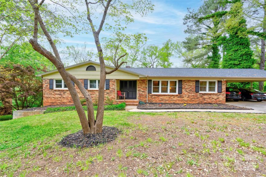 Welcome to this spacious home offering 5 bedrooms, 3 full baths, and an abundance of flexible living space perfect for families of all sizes. Features neutral decorator colors throughout, this home combines comfort, functionality, and classic charm.  Step inside to discover multiple living and family rooms, a cozy fireplace with gas logs, and a formal dining room ideal for hosting. The eat-in kitchen provides plenty of space for casual meals and everyday living. Two of the bathrooms have been updated, and the home features newer windows, roof, shutters, soffit, and fascia—adding peace of mind and curb appeal.  Downstairs, most of the basement is finished, creating the perfect setup for second living quarters.  Enjoy outdoor living on the deck overlooking the  fenced backyard, perfect for kids, pets, or entertaining. Home has an oversized double carport.  Conveniently located close to schools, shopping, and major roadways, this move-in ready home is a rare find with room to grow!