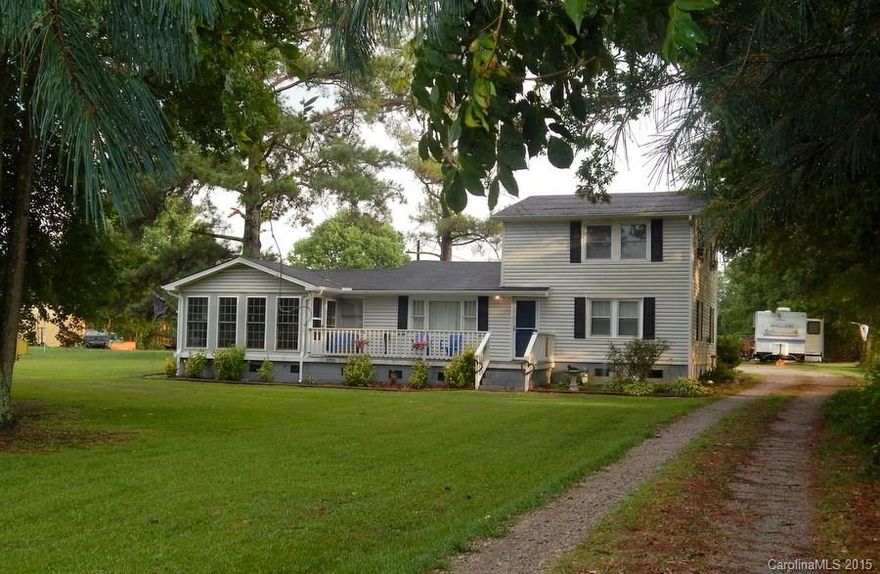 Follow the drive way to this wonderful home with a southern feel. This home features crown molding throughout, spacious bedrooms, tons of cabinet space in the kitchen, beautiful laminate wood flooring, and more! Relax in the sun room after a long day. The back yard also offers a large fenced area. Sellers offering 1 year home warranty!