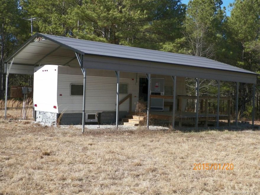 If you are looking for a weekend get away or a rural location to build your dream home, this property may be the one for you.  It features 17+- acres located on an unpaved county road with a 2006 Year Built Gulf Stream Cavalier Travel Trailer set up with well, septic tank and front deck, that is ready for your weekend camp out!  The property is part open/part wooded and is bordered by part of Rocky Creek.