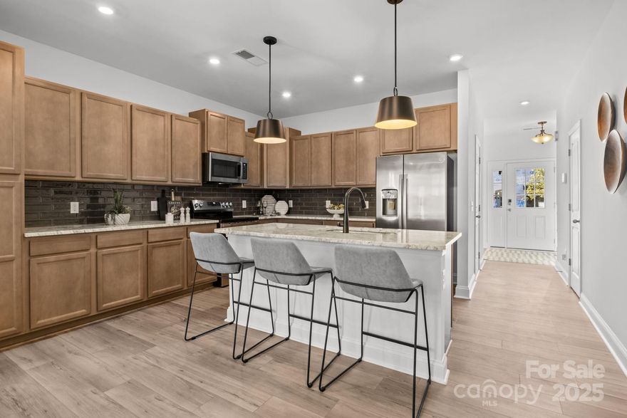 The Most Conveniently Located New Luxury Townhome Community Starting From the Lower $300s!

Welcome to Bell Glen by premier builder DRB Homes, an exclusive collection of just 54 craftsman-style townhomes perfectly positioned for Charlotte living. Minutes to I-485, HWY 16, Charlotte Douglas Airport, and Uptown—this location delivers serious connectivity at an incredible price point.

Inside, discover open-concept living designed for modern lifestyles. The expansive kitchen island serves as the home's centerpiece, ideal for meal prep, casual dining, or entertaining. Durable Luxury Vinyl Plank flooring flows throughout the main level, combining style with easy maintenance.

Stunning exterior elevations feature partial stone accents, board and batten siding, shaker shingles, and inviting covered entrances that elevate curb appeal across the community.

Upstairs, the oversized primary suite offers a true retreat. The spa-inspired owner's bath showcases floor-to-ceiling tile, a solid surface shower seat, semi-frameless glass door, and private water closet. Generously sized secondary bedrooms and convenient linen closets in every upper-level bath add everyday functionality.

Special Note: Representative photos from model home shown.
This is where buyers find exceptional value without compromise—thoughtful design, premium finishes, low-maintenance living, and prime Charlotte connectivity.