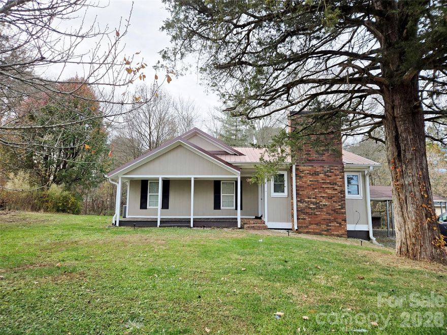 MOTIVATED SELLER! Charming 2 Bedroom 1.5 bath bungalow located in rural Hiddenite.Enter the spacious living room from the covered front porch to find lots of natural sunlight. Living room does offer a fireplace with electric logs. Living flows into the kitchen area where you will find plenty cabinet / counter space and all appliances to remain. Walk In pantry offers more storage. Both bedrooms are spacious with adequate closet space. There is flex area that seller used as an office. Mud room features additional closet space for storage. Laundry is located in mud room. Off the kitchen you will find a covered back deck overlooking partial cleared yard. New septic tank was install in 2023. Seller relocated shortly after purchasing and has no representation to condition. Property is being sold AS-IS.