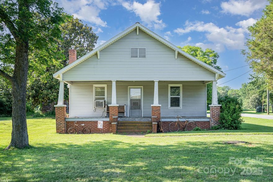 Endless Possibilities Await on Nearly 5 Acres! This unique property offers two homes and a wealth of opportunity! This home is a blank canvas, ready for your personal touch and creative vision. Whether you're thinking of a guest house, rental income, multigenerational living, or a dream project, the potential is limitless. Properties are adjacent, with nearly 5 acres complete with a large barn, milking parlor, and multiple outbuildings ready to support your hobbies, business ideas, or homesteading dreams. The adjacent home has been beautifully renovated from top to bottom since 2021, featuring a new roof, guttering, quartz countertops, new flooring throughout, updated lighting, ceiling fans, bathroom vanities, shiplap accents, tile backsplash, fresh drywall, & modern fixtures—creating a move-in ready haven with thoughtful updates at every turn. These properties offer an incredible opportunity to create the lifestyle you’ve been dreaming of. 4710 Mooresville Rd is adjacent property