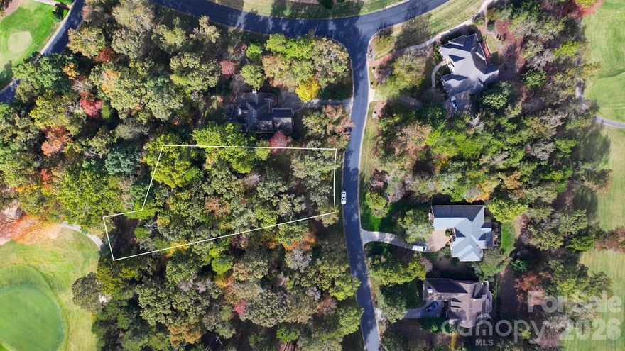 Located on the par 4 12th hole at the Old North State Club golf course in the Uwharrie Point community. This is a beautiful, wooded lot with .66 acres. This is a championship golf course and memberships are available with swimming, tennis, fitness, fine dining and a full service marina as the amenities. Uwharrie Point is a gated community located on Badin Lake and is a wonderful place for boating and water sports.