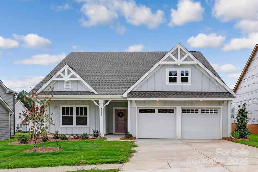Golf course living at its finest in this semi-custom 3BR/2BA Montcrest in The Links at Edgewater—Charlotte’s 2024 Community of the Year! This thoughtfully designed one-story ranch welcomes with a charming front porch, open layout, and a screened back porch perfect for relaxing or entertaining. The gourmet kitchen shines with quartz counters, a tile backsplash, large island, gas range, and upgraded lighting. Enhanced flooring and 9' ceilings add style throughout. The spacious primary suite offers a luxurious ensuite and walk-in closet. Enjoy lakeside living with access to Fishing Creek Lake for kayaking, boating, and fishing. Edgewater also features a nationally ranked 18-hole golf course, resort-style pool, clubhouse, pickleball courts, scenic walking trails, and lakeside dining at Brickwood Restaurant. Designed for those who love the outdoors and an active lifestyle—Edgewater blends recreation, relaxation, and upscale living.