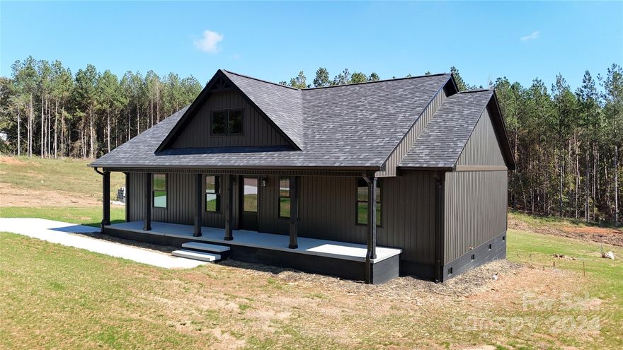 Step into a home like no other. This stunning new construction home features a bold, moody dark exterior that contrasts beautifully with its bright and airy interior.  Once inside you're greeted by an open, light-filled living space with large windows that flood every room with natural light.  The thoughtful design combines clean lines and warm finishes, creating a welcoming atmosphere perfect for both entertaining and relaxing. The expansive living area offers seamless flow to the outdoor space ideal of enjoying indoor-outdoor living.  This brand new home has three bedrooms, two baths, includes stainless appliances and an alarm system.