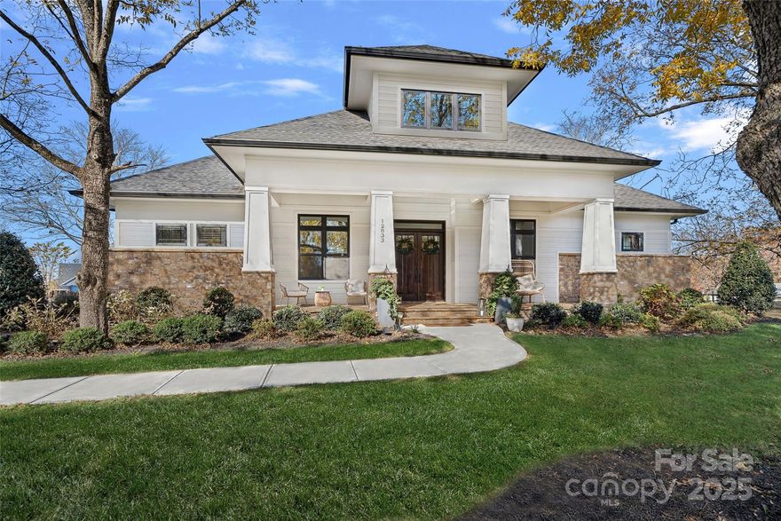 This meticulously crafted custom modern ranch blends elevated design, thoughtful one level living, and resort style outdoor amenities with impeccable craftsmanship and details throughout. Situated on over an acre of private, fenced grounds, the home offers exceptional attention to detail and a layout crafted for both comfort and entertaining.

A welcoming covered front porch leads into a light filled interior highlighted by tall ceilings, exposed wood beams, and impressive trim work. The split bedroom layout provides privacy, while an executive office offers a quiet space for work or study. The primary owners retreat features oversized his and her closets and a spa inspired bath with soaking tub, tiled shower, and Restoration Hardware double vanity. Each ample sized secondary bedroom includes its own private ensuite bath.

The gourmet chef’s kitchen showcases a large center island, 6 burner gas range, Café Collection appliances, and beautiful cabinetry, all opening to a spacious living area and sunny breakfast room. French sliders extend the living space to a covered patio with outdoor fireplace overlooking the modern heated pool and spa. A dedicated cabana bath provides convenient access from the pool terrace.

The finished room above the oversized two car garage is ideal for a gym, flex space, or bonus room. The expansive fenced backyard offers generous room to enjoy the outdoors, with space for entertaining and recreation, pets, or gardening alongside the pool.  With privacy, luxury finishes, direct access to the greenway, and close proximity to Davidson, Cornelius, and Northcross conveniences, this home delivers refined living in a premier quiet setting.