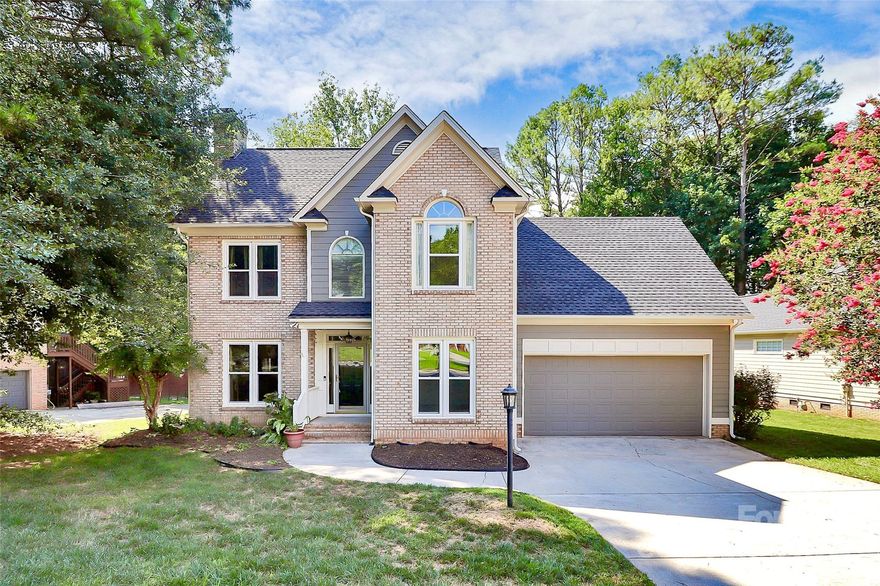 Located in Rock Hill's sought-after Ashley Park neighborhood, this well maintained two-story home welcomes you with wood flooring and crown molding throughout the main level. Enjoy relaxing on the screened in porch or entertaining on the deck overlooking the wooded backyard. Upstairs oversized owner's suite offers a tray ceiling and sitting area with separate tub and jacuzzi shower in the en suite. Surprise spacious bonus room over garage is off secondary bedroom with vaulted ceilings - perfect for private office/study, workout room, play area, or however best suits your needs. New carpet being installed 09/13 throughout upstairs level + staircase.