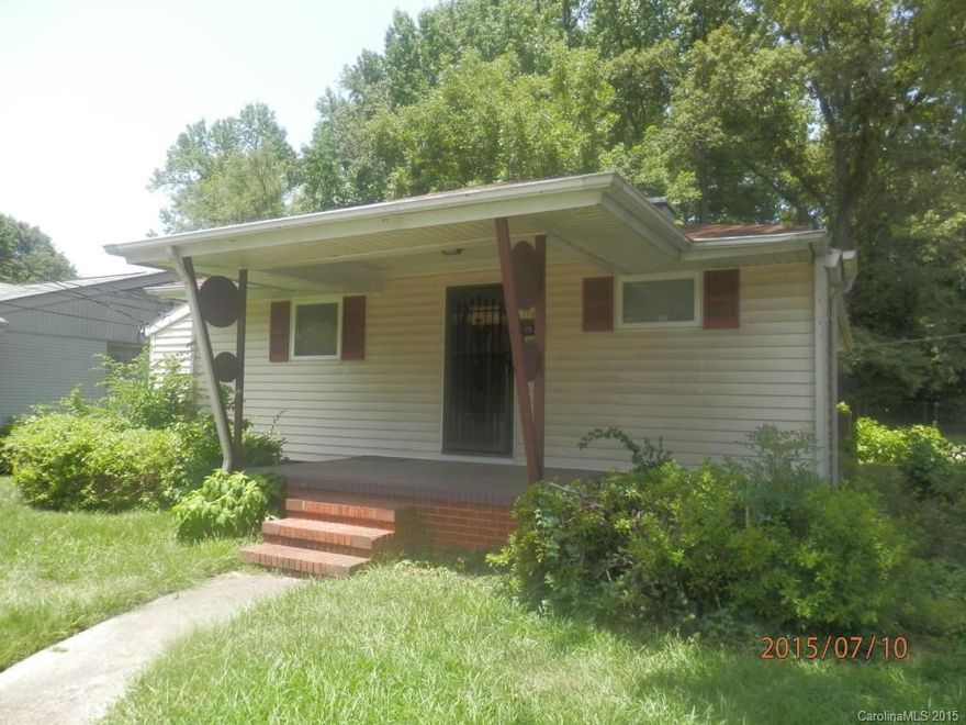 Brick Ranch, Large Covered Front Porch, Three Bedrooms, Carpet Throughout, Updated Kitchen, Corner Lot. Ready for Immediate Occupancy