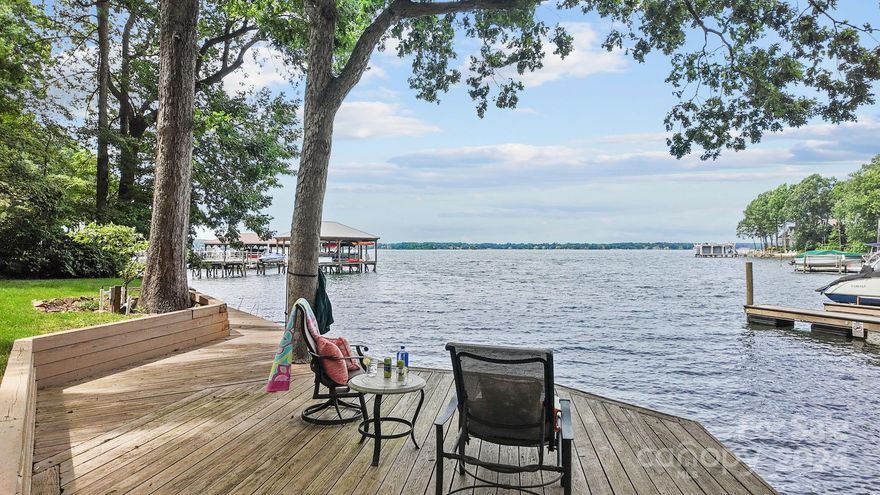 Welcome to 16116 North Point Rd, a beautifully renovated private waterfront retreat nestled in a serene and picturesque setting. This exquisite property offers a perfect blend of modern luxury and natural beauty. You are greeted by an open-concept living space that exudes warmth and elegance. The spacious living area allows for an abundance of natural light and breathtaking views of the water. The gourmet chef's kitchen boasts high-end stainless steel appliances, custom cabinetry, and a large center island with seating. The primary suite with a spa like bathroom is a true retreat, wake up to stunning water views that can be enjoyed from your private balcony. Outside, discover your own personal paradise. The expansive deck is perfect for outdoor entertaining, with a dining area, lounge space & built-in grill all overlooking the water. The beautifully landscaped yard leads to your private waterfront boardwalk with over one hundred feet of shoreline.