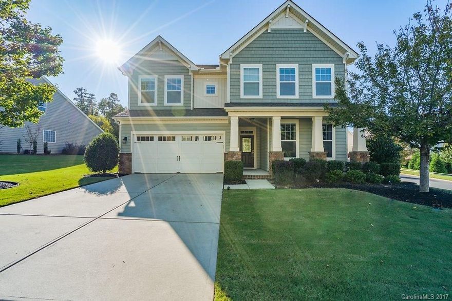 Pristine home in highly desired Fort Mill community just minutes to I-77. Nice lot with tree lined back yard, custom patio, & large covered porch. Home features wood floors on main level, granite, stainless appliances, stone accent wall in family room with TV included, ceiling fans, built-in storage hooks & cabinets. Refrigerator,washer & dryer included in sale!  Community is well maintained w/ pool, basketball court, playground, & club house.