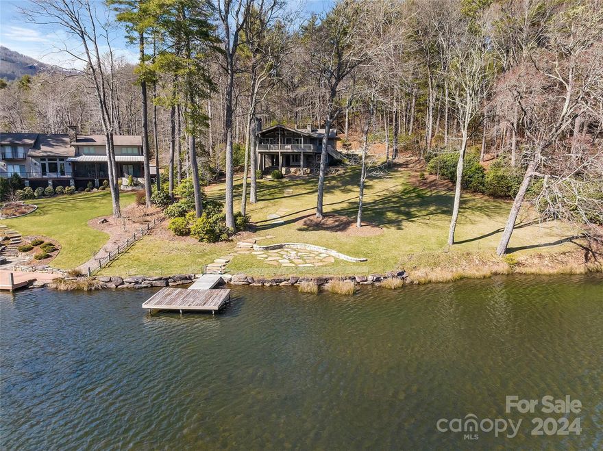 Absolutely charming, fully renovated 4 BR, 2 BA home on a gentle lot and a half overlooking Skier's Cove on fabled Lake Toxaway. This quintessential lake home features a stunning kitchen, two stone fireplaces, two bedrooms on the main floor, beautifully finished sunroom, spacious back covered porch with fireplace, renovated bathrooms, home dehumidifier, new dock, and fantastic firepit overlooking Lake Toxaway.