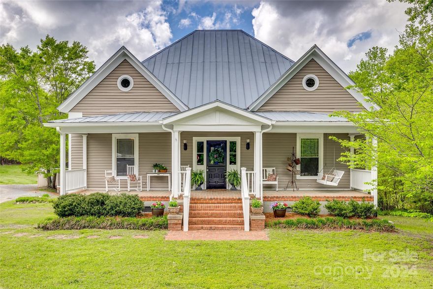 Early Century Farmhouse w/ perfect updates while still keeping the original charm. Large welcoming Covered Front Porch. As you enter the Wide Hallway with tall Ceilings, you'll notice the beautiful original hardwood floors & trim, arches, & plenty of space for functional use. There are 3 spacious bedrooms w/ 2 full bathrooms. The Primary Bathroom features a claw foot tub & the 2nd bathroom is updated w/ a walk-in shower. There is a formal living area w/ a Bay Window & custom built-in hutch. From the living room is a convenient butler's pantry area that leads to the kitchen & utility/laundry room. The updated kitchen has white cabinets, stainless steel appliances, & LVP flooring. Off of the kitchen is a Covered Rear Porch that wraps around to the side, w/ a side entrance to the mudroom area & an additional Flex Room. Out back is a Detached 2 car garage with additional storage area behind, storage shed, & expansive back yard. There's also a walk-in crawl/basement w/ storage & workshop.