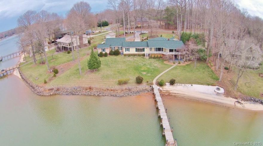 6 Month or 12 Month Available. Water Views from Most rooms of this updated 3br, 3.5ba Ranch w/Basement Home w/approx 193’ of WF on .84+/- acre. Large Kitchen has large island, granite, glass tile backsplash, SS appliances & B'fast nook. Master Suite has walk in closet, claw foot tub, stall shower & its own H2O heater. Walk out basement has 2nd Kitchen, FP w/wood stove, 1/2 BA & opens to covered patio. Large porches looks out over yard, sandy beach, Lake Norman, pier & fire pit.