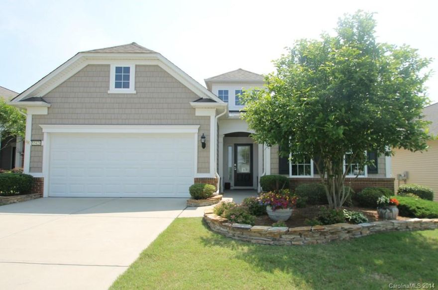 Popular Vernon Hill Model Features 3BD/2BA, Office, Screened Porch & Tons of Upgrades! Gourmet Kitchen with Stainless Steel Appliances, Granite Countertops, Maple Cabinets, Tile Backsplash and Breakfast Nook with Built In Desk. Wood Floors Throughout Living Area. Tile in Screened Porch and  Bathrooms. Custom Landscaping! Amenities Galore in this Active Adult Community!