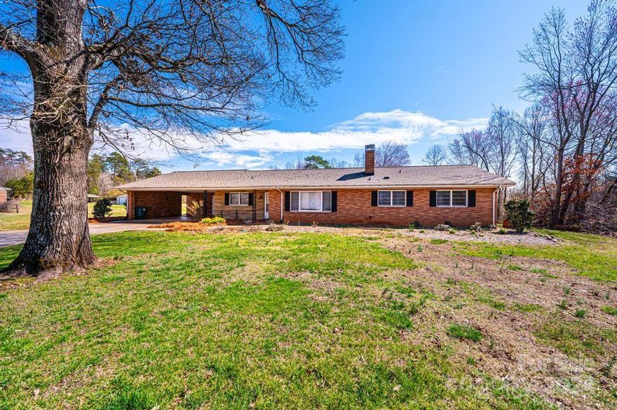 Quality of Yesteryear + LAND. 4 BR/2.5 BA ranch on 1.59 acre. What an opportunity to have the quality, space, some updates + a beautiful level lot. Huge kitchen featuring cabinets galore, stainless steel dw, bottom drawer refrig, pull out cabinets, desk area, & a large sunny area for a big table. Adjacent to the kitchen is a 1/2 bath & laundry room with an exterior door. Great room with remote control blinds, brick wood burning FP , and lots of windows. All bedrooms are large-scale with heavily padded carpet. Large hall bath. Primary suite has 2 WICs. Primary bath has been remodeled with a tile walk-in shower, toilet, vanity, & light fixtures. Amazing workshop room off the carport with a wicket door (door inside a door). New septic 2020, Trane HP 2015, invisible dog fence, Roof 2019 (50 yr shingle).