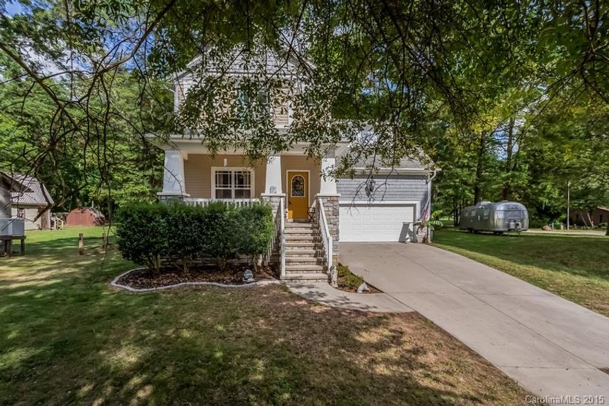 Lovely home on large lot near from community dock access to Catawba river. Enjoy rocking chair front porch w/beautiful scenic views. Warm fireplace anchors the living room while hardwood floors flow throughout main living area. Bright sunny kitchen with breakfast area w/French doors leading to a large deck &picturesque backyard. MS with accent lighting, soaking tub, &separate shower. Spacious bonus room that's versatile to suit your living needs. whole house has elevated ceilings!