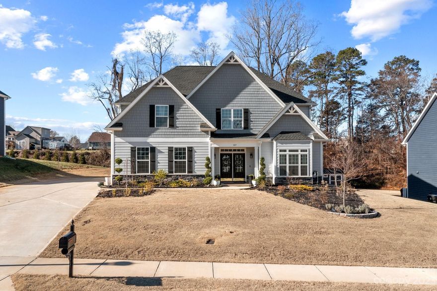 Welcome to this upgraded home that combines elegance w/ modern convenience.Walk in through the lovely front porch w/double door entry to be greeted by a 2 story foyer.You'll find an office w/ french doors, formal dining room w/coffered ceiling, large kitchen w/open floor plan, cathedral ceiling family room w/gas fireplace, main floor laundry, locker storage, guest 1/2 bath, an oversized primary suite w/ a spa-like bathroom & huge walk-in closet. Upstairs, you'll find a versatile loft area, 3 bedrooms (one w/ a Jack & Jill bathroom) & one w/it's own ensuite.You'll love the tasteful wallpaper that adorns the 1/2 bath as well as upgraded lighting fixtures & exquisite woodwork design throughout the house.Even the garage floor has been enhanced with epoxy coating.This charming residence also boasts an Electric Vehicle charger, an expansive covered patio overlooking a flat backyard (already w/ electrical run to add a pool some day) & a handy storage shed.All this & in lovely Mooresville too!