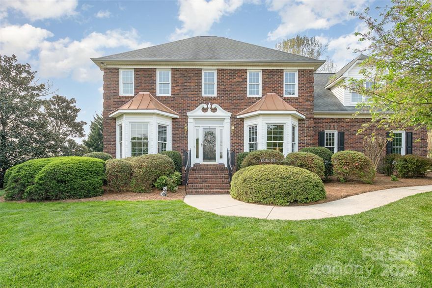 Welcome to your dream home in the coveted Camelot neighborhood in Harrisburg! Step inside this all brick beauty to discover stunning luxury vinyl plank flooring that seamlessly flows from the foyer to the dining room, den, and family room. The spacious family room is adorned with a charming fireplace and a ceiling fan and leads to the kitchen. The eat-in kitchen is a chef's delight, featuring granite countertops, stainless steel appliances, and wood cabinets. Fresh paint and brand-new carpet adorn most of the rooms upstairs. The expansive primary suite with private bath features brand-new quartz countertops, dual sinks, a walk-in shower, and a luxurious soaking tub. Additionally, upstairs, you'll find an oversized bedroom/bonus room, offering versatility for use as a bedroom, home office, or even a gym – the choice is yours! Outside, the backyard  is perfect for outdoor entertaining, with a large deck and a flat fenced yard. Great location- close to shops, dining and 485