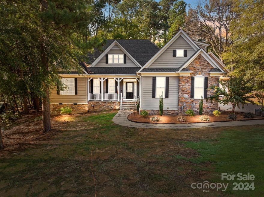 Welcome to this gorgeous home with lake access right in the community.  This home features 3 bedrooms and 2 full baths.  The kitchen has been remodeled with top of the line appliances, an oversized island great for meal prepping, two sinks, pot filler and under cabinet lighting.  The primary bedroom, located on the main floor, offers ample space for all your furniture and an oversized custom walk in closet.  The primary bath has a heated towel rack and heated floors, that's right heated floors, perfect for those cold mornings.  Upstairs you will find a bonus space perfect for an office, play room, or fitness area.  Did I mention that the home has an attached 2 car garage AND a separate 2 car garage, perfect for parking, a workshop, the options are endless. Above the garage is an additional living space, 1 bedroom, 1 bath, heated, with its own kitchen.  This home offers endless opportunities.  You do not want to miss this one!