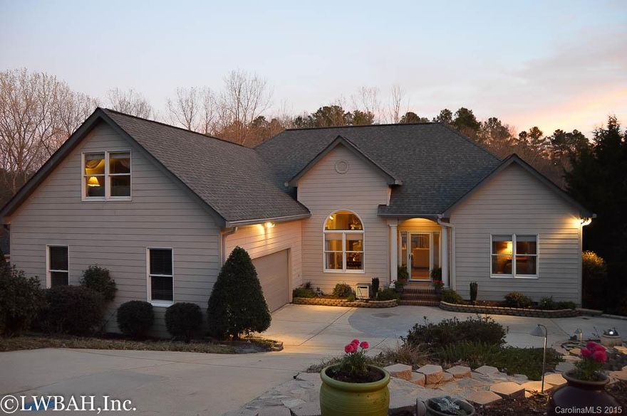 Stunning waterfront home in Tega Cay. Open floor plan with hardwood floors throughout main living area. Remodeled kitchen with granite counters perfect for entertaining. Master retreat with lake view, tray ceiling and walk in closet. Large bonus room and walk in attic for extra storage. Watch the sunset from the large awning covered deck or the included assigned boat slip. Community amenities include tennis courts, golf course, club house, pool, fitness center and MORE!